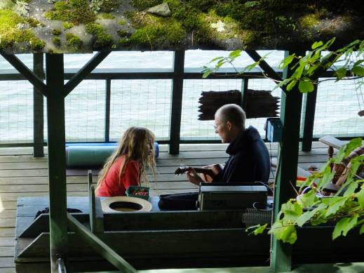 Boy and uncle on boathouse