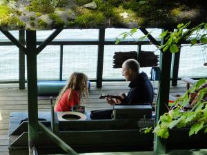 Boy and uncle on boathouse