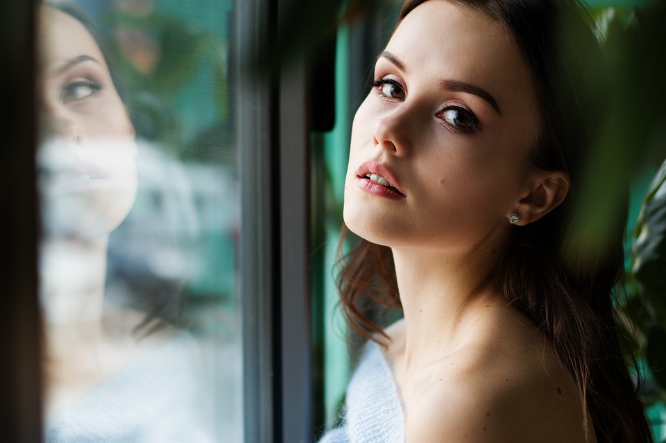 WomanReflectedInGlass