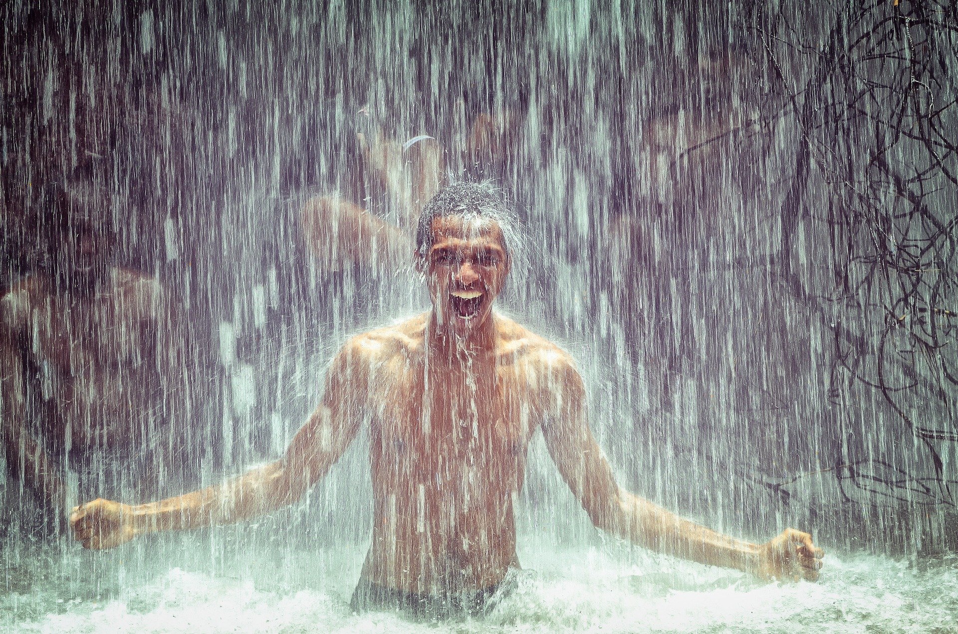 man-under-waterfall-2150164_1920